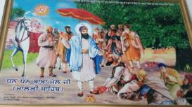 Baba Mal Ji offering a pair of Juti to Sri Guru Arjan Dev Ji